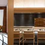 a cozy restaurant featuring a bar and a welcoming dining area for guests to enjoy